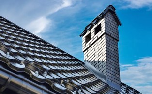 Chimney and flashing on a shingle roof
